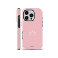 Minimalist white crown outline on a solid pastel pink phone case, compatible with iPhone, Samsung Galaxy, and Google Pixel models.