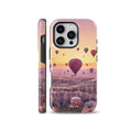 Dreamy phone case featuring colorful hot air balloons flying over a scenic valley at sunset, available for iPhone, Samsung Galaxy, and Google Pixel models.
