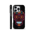 Black phone case featuring a bright neon Mexican Sugar Skull with colorful pink, cyan, and orange floral patterns, compatible with iPhone, Samsung Galaxy, and Google Pixel devices.