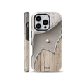 Neutral tone phone case featuring a minimalist split design with light wood texture, smooth beige surface, silver metallic contour line, and a single pearl accent against a white crystal backdrop. Fits iPhone, Samsung, and Pixel devices.