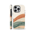An aesthetic phone case featuring an abstract landscape design with layered mountains in terracotta, sage green, and cream tones, designed for iPhone, Samsung, and Pixel.