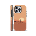 Terracotta sunset phone case illustration showing a shepherd walking with a dog and sheep, presented on iPhone and compatible with Samsung Galaxy and Google Pixel models.
