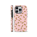 Pink phone case featuring a cute pattern of yellow illustrated bananas, shown from front and side profiles, compatible with iPhone, Samsung, and Pixel devices.