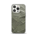 Clear phone case featuring a realistic sage green stone texture print with a delicate embossed botanical plant branch design for iPhone, Samsung, and Pixel.